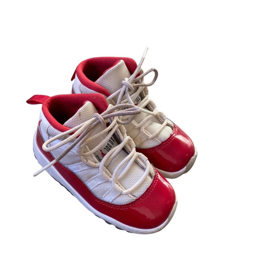 Red and white toddler Jordan 11s.